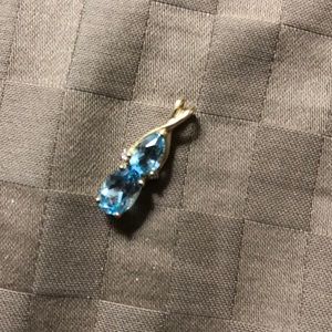 Blue topaz and gold pendant